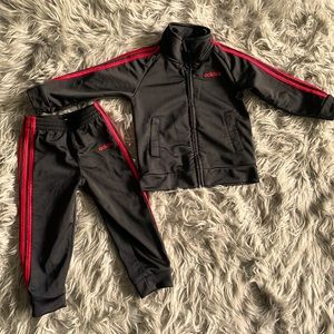 Two piece red and black adidas jogger with zipper